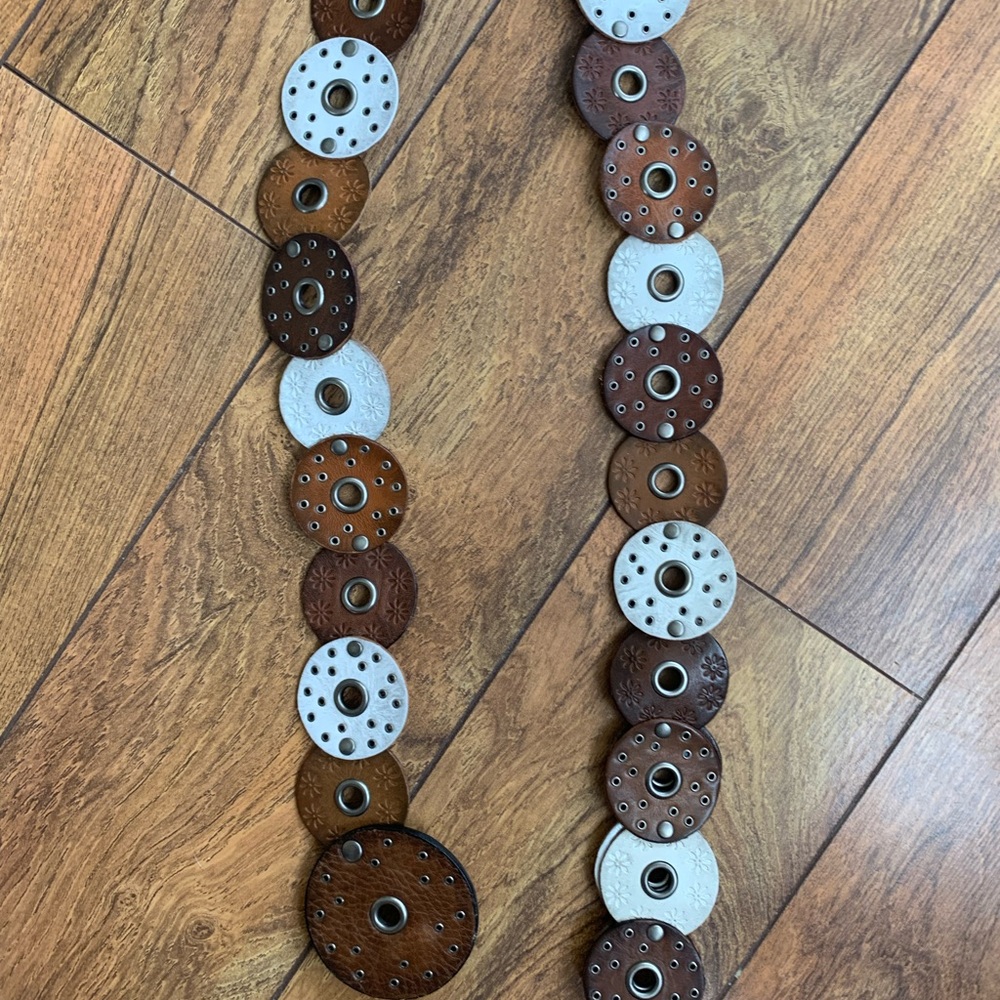 Brown and Silver Circular Disc Belt